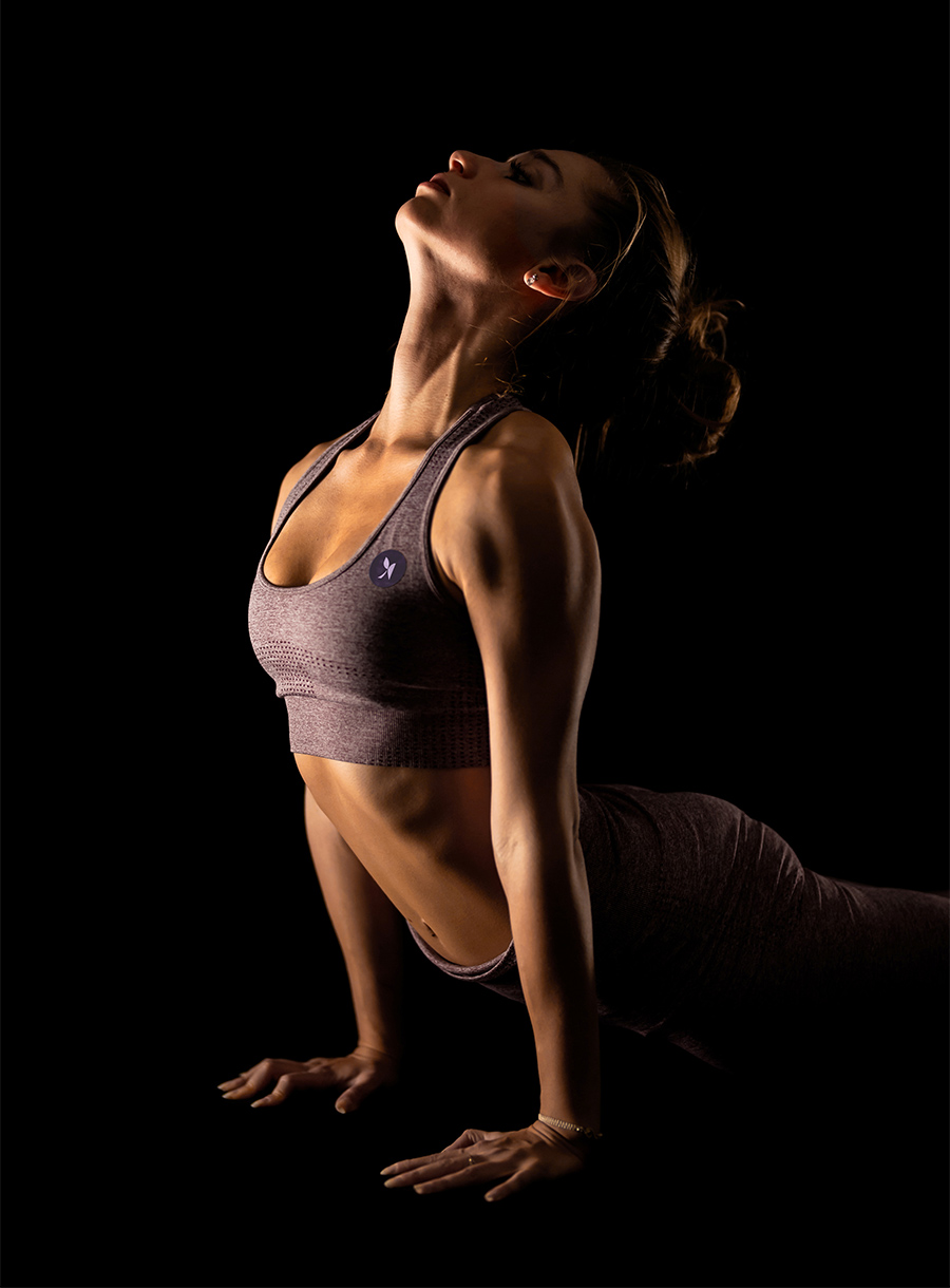 Closeup of woman doing upward dog stretch